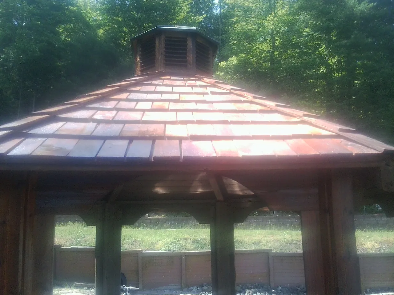 New cedar shake roof and cupola on a lakeside gazebo in Lawrenceburg